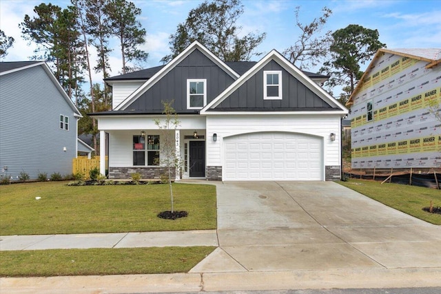 craftsman-style house featuring a porch, a garage, and a front lawn