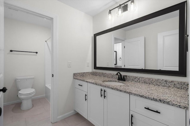 full bathroom with washtub / shower combination, tile patterned floors, vanity, and toilet