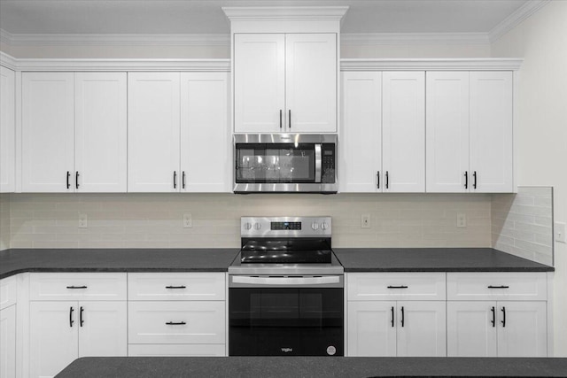 kitchen featuring decorative backsplash, white cabinets, and stainless steel appliances