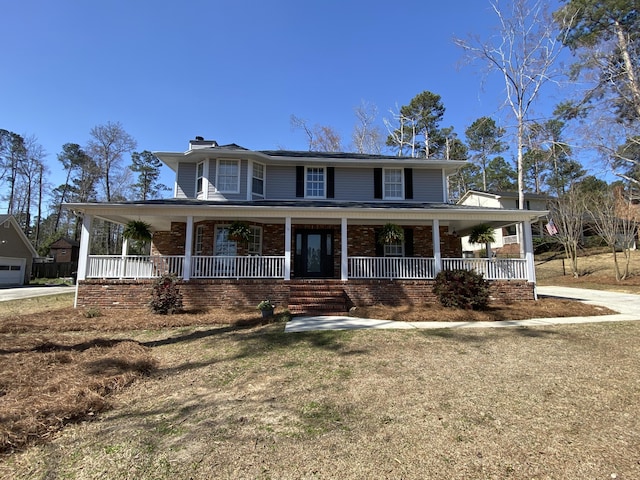 country-style home featuring covered porch, a chimney, and brick siding