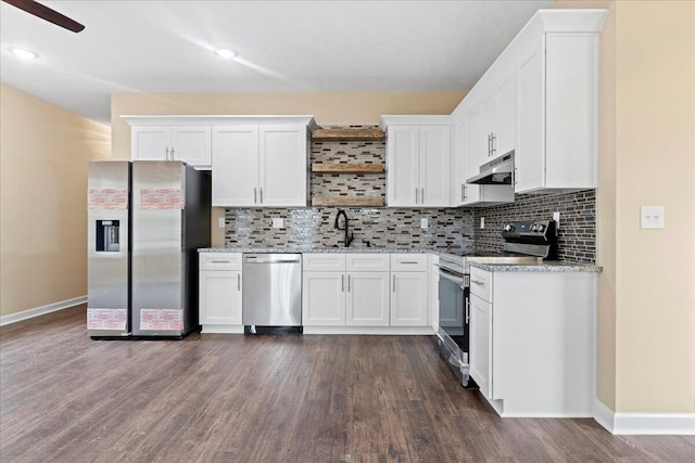 241 Walker St, Augusta, GA 30901 - kitchen with appliances with stainless steel finishes, under cabinet range hood, baseboards, a sink, and white cabinets