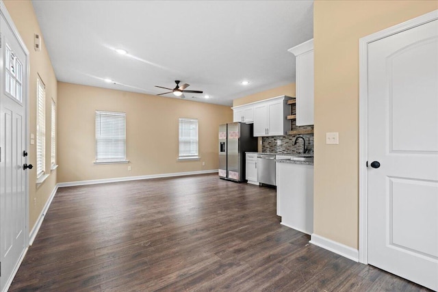 241 Walker St, Augusta, GA 30901 - kitchen featuring stainless steel appliances, ceiling fan, dark wood-style flooring, white cabinetry, and open floor plan