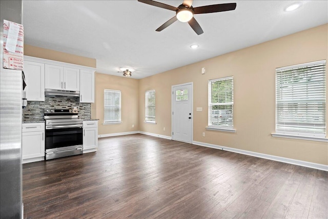 241 Walker St, Augusta, GA 30901 - kitchen featuring appliances with stainless steel finishes, under cabinet range hood, ceiling fan, dark wood finished floors, and white cabinetry