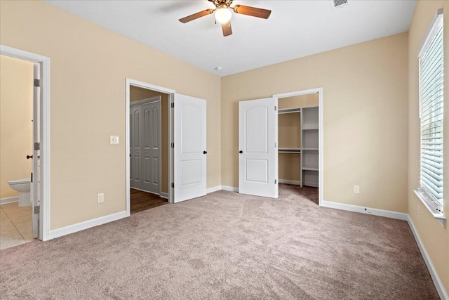 241 Walker St, Augusta, GA 30901 - unfurnished bedroom with carpet flooring, a spacious closet, ensuite bathroom, and baseboards