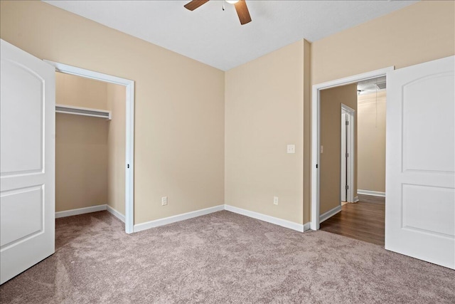 241 Walker St, Augusta, GA 30901 - unfurnished bedroom featuring carpet floors, baseboards, a walk in closet, a closet, and ceiling fan