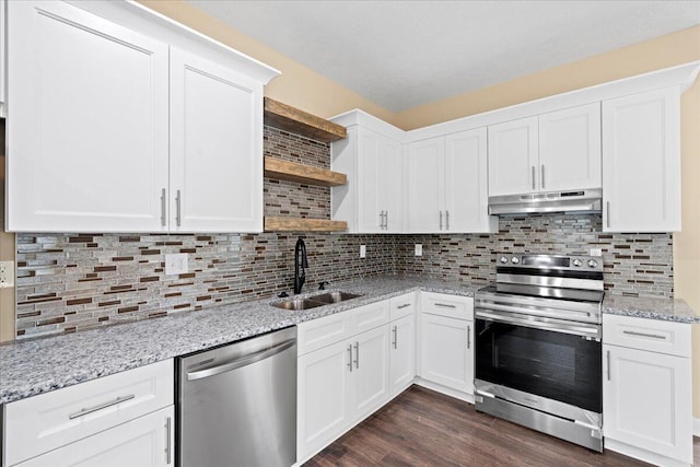 241 Walker St, Augusta, GA 30901 - kitchen with stainless steel appliances, under cabinet range hood, open shelves, a sink, and white cabinetry