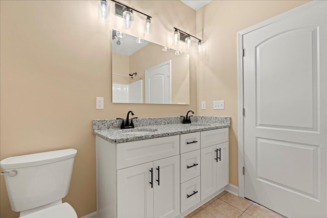 241 Walker St, Augusta, GA 30901 - bathroom featuring double vanity, tile patterned floors, toilet, and baseboards
