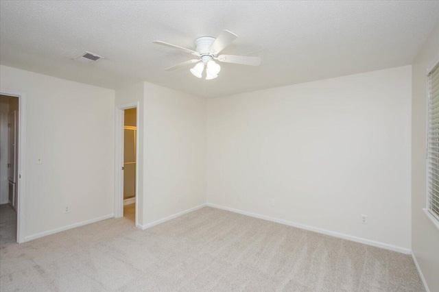 327 Joshua Tree Dr, Martinez, GA 30907 - unfurnished bedroom featuring light carpet, baseboards, and ceiling fan