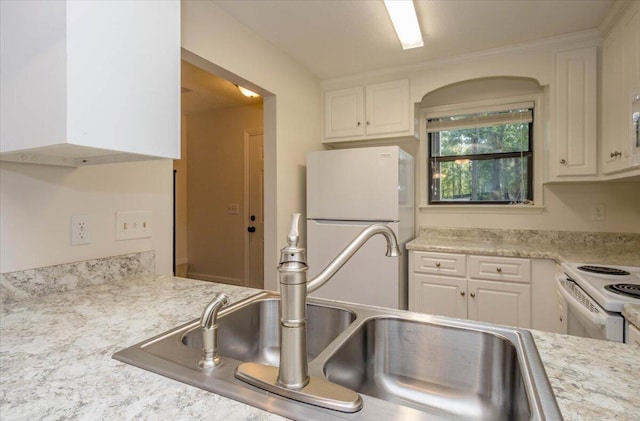 327 Joshua Tree Dr, Martinez, GA 30907 - kitchen with white appliances, a sink, light countertops, and white cabinetry
