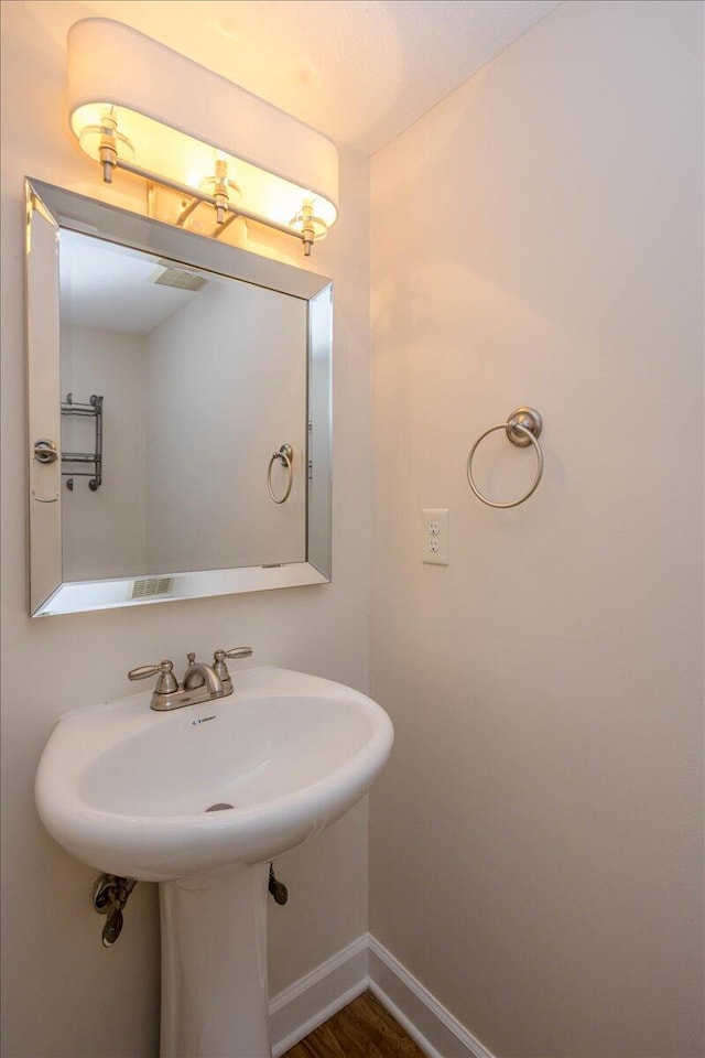 327 Joshua Tree Dr, Martinez, GA 30907 - bathroom with baseboards and a sink
