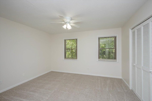 327 Joshua Tree Dr, Martinez, GA 30907 - unfurnished bedroom featuring light colored carpet, multiple windows, and a closet