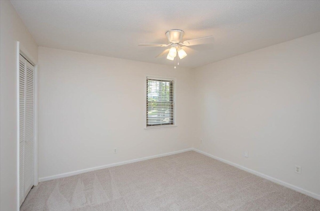 327 Joshua Tree Dr, Martinez, GA 30907 - unfurnished bedroom with light colored carpet, a closet, baseboards, and ceiling fan