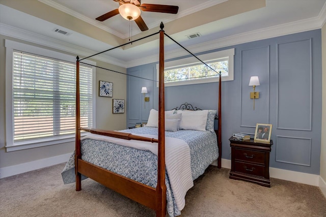 bedroom with ceiling fan, light colored carpet, and crown molding