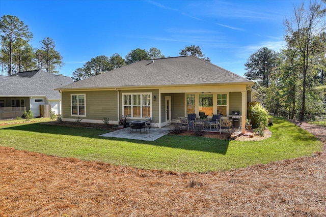 rear view of property with a patio area and a yard