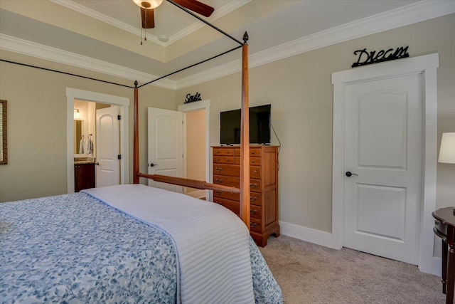 bedroom featuring ceiling fan, light colored carpet, ensuite bathroom, and ornamental molding