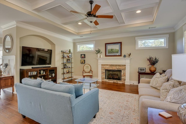 living room with a healthy amount of sunlight, ceiling fan, coffered ceiling, and hardwood / wood-style floors