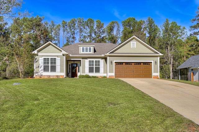 view of front of house with a front yard and a garage