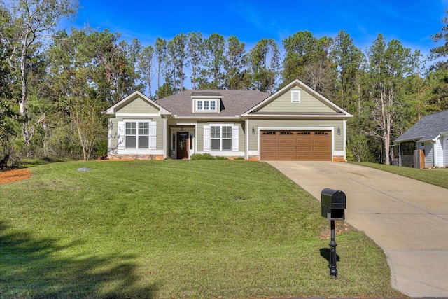 view of front of property featuring a garage and a front lawn