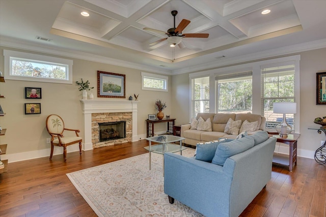 living room with a fireplace, ceiling fan, crown molding, and coffered ceiling