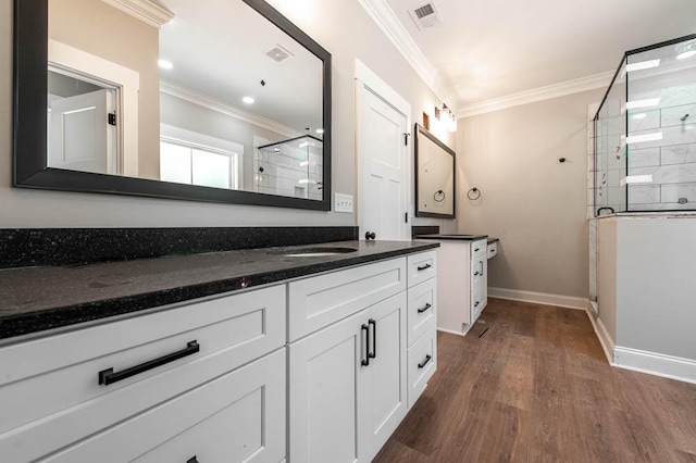550 Bogey Ct, Graniteville, SC 29829 - full bath with a shower stall, vanity, wood finished floors, crown molding, and baseboards