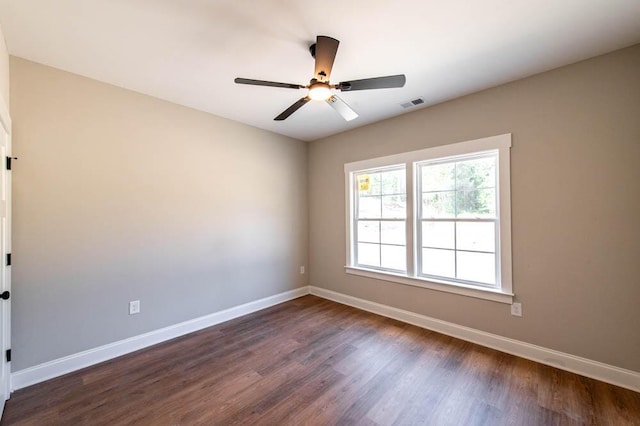 550 Bogey Ct, Graniteville, SC 29829 - unfurnished room with dark wood-style floors, a ceiling fan, and baseboards
