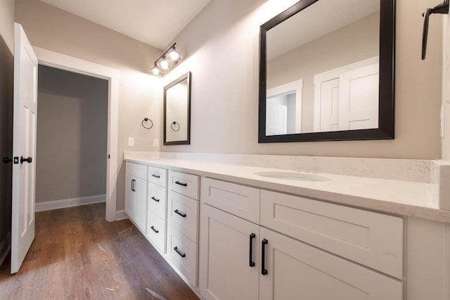 550 Bogey Ct, Graniteville, SC 29829 - full bathroom featuring double vanity, wood finished floors, and baseboards