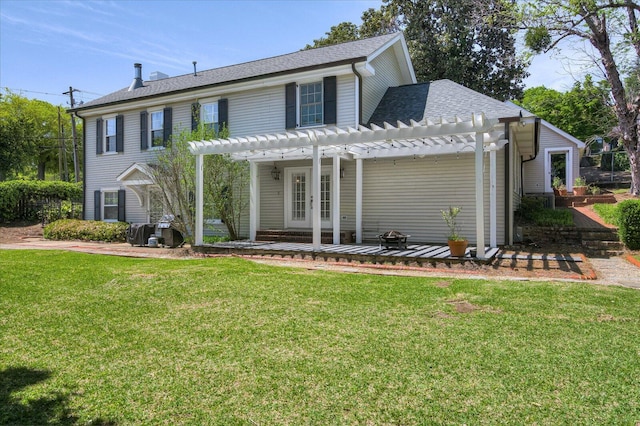 view of front of home with a pergola, french doors, and a front lawn