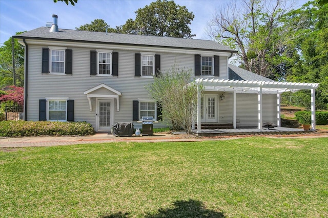 view of front of house featuring a pergola and a front yard