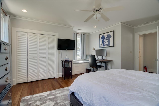 bedroom with crown molding, ceiling fan, a closet, and dark wood-type flooring