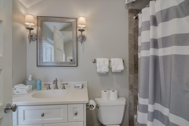 bathroom featuring vanity, toilet, curtained shower, and lofted ceiling