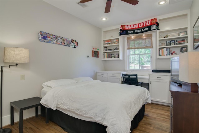 bedroom featuring ceiling fan and dark hardwood / wood-style flooring