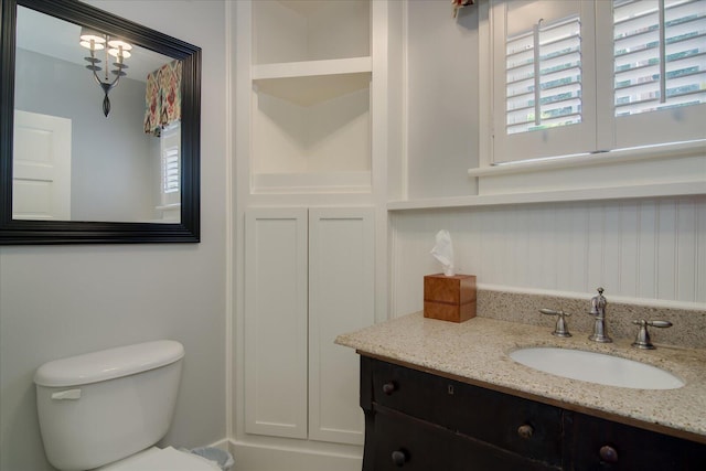 bathroom with vanity and toilet