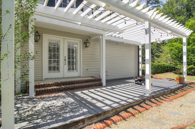 view of patio / terrace with a pergola and french doors