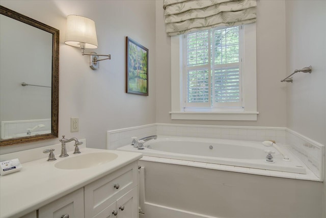 bathroom with a tub to relax in and vanity