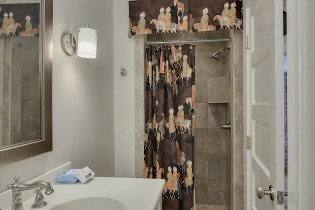 bathroom with a shower with curtain and vanity