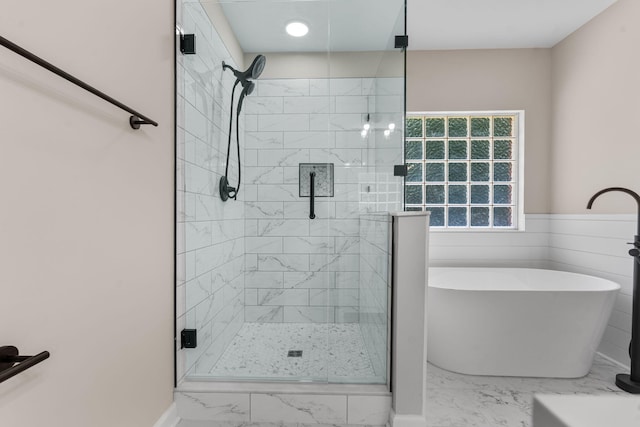 4200 Waters Edge Ln, Appling, GA 30802 - bathroom with marble look tiles, a freestanding bath, and a shower stall