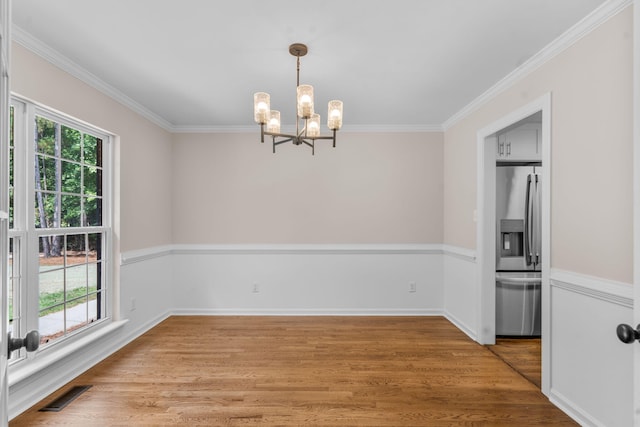 4200 Waters Edge Ln, Appling, GA 30802 - empty room with a chandelier, ornamental molding, and light wood-style flooring