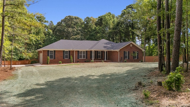 4200 Waters Edge Ln, Appling, GA 30802 - ranch-style home with gravel driveway, brick siding, and view of scattered trees