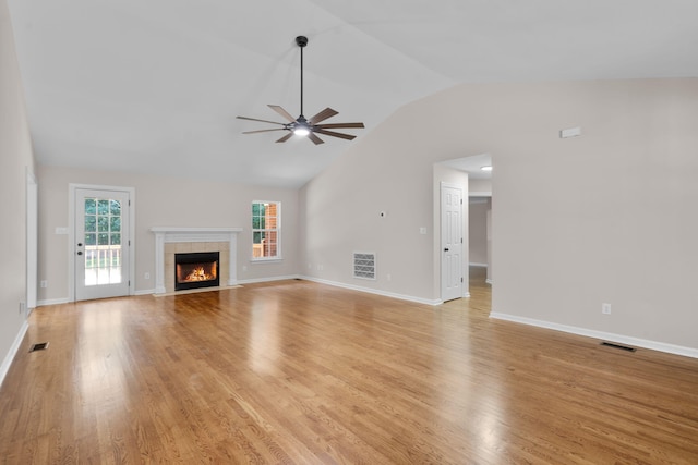 4200 Waters Edge Ln, Appling, GA 30802 - unfurnished living room featuring a ceiling fan, light wood-type flooring, lofted ceiling, and a tile fireplace