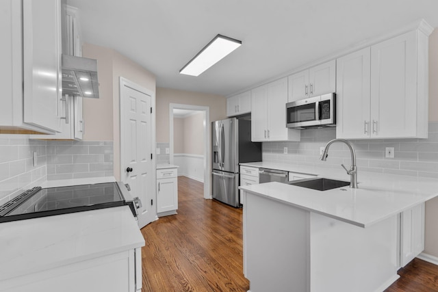 4200 Waters Edge Ln, Appling, GA 30802 - kitchen with appliances with stainless steel finishes, a peninsula, white cabinets, and backsplash