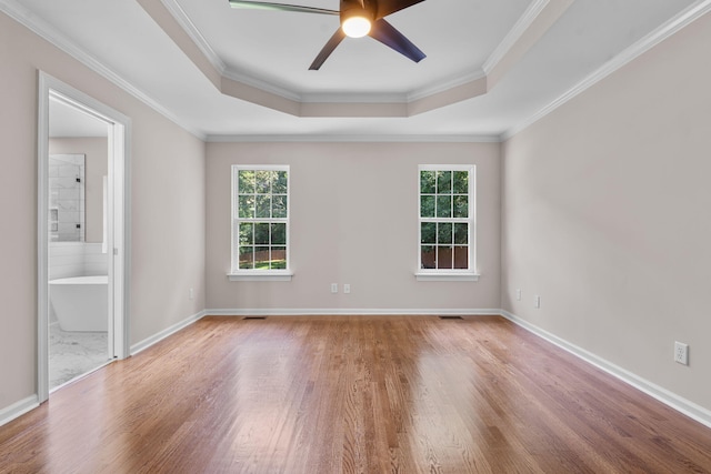 4200 Waters Edge Ln, Appling, GA 30802 - spare room with healthy amount of natural light, wood finished floors, a tray ceiling, ceiling fan, and crown molding