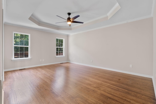 4200 Waters Edge Ln, Appling, GA 30802 - unfurnished room with a tray ceiling, healthy amount of natural light, ceiling fan, ornamental molding, and wood finished floors