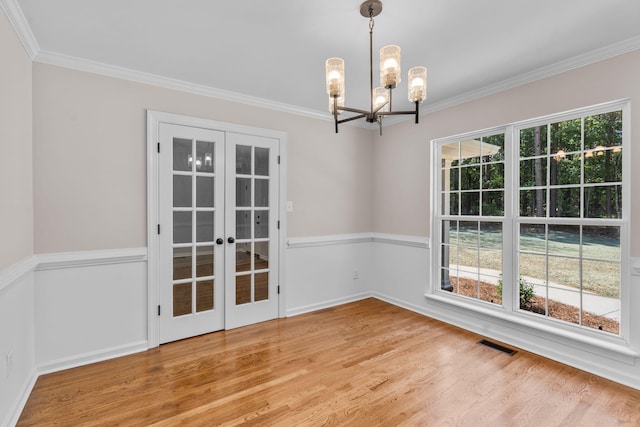 4200 Waters Edge Ln, Appling, GA 30802 - empty room featuring a chandelier, ornamental molding, wood finished floors, and french doors