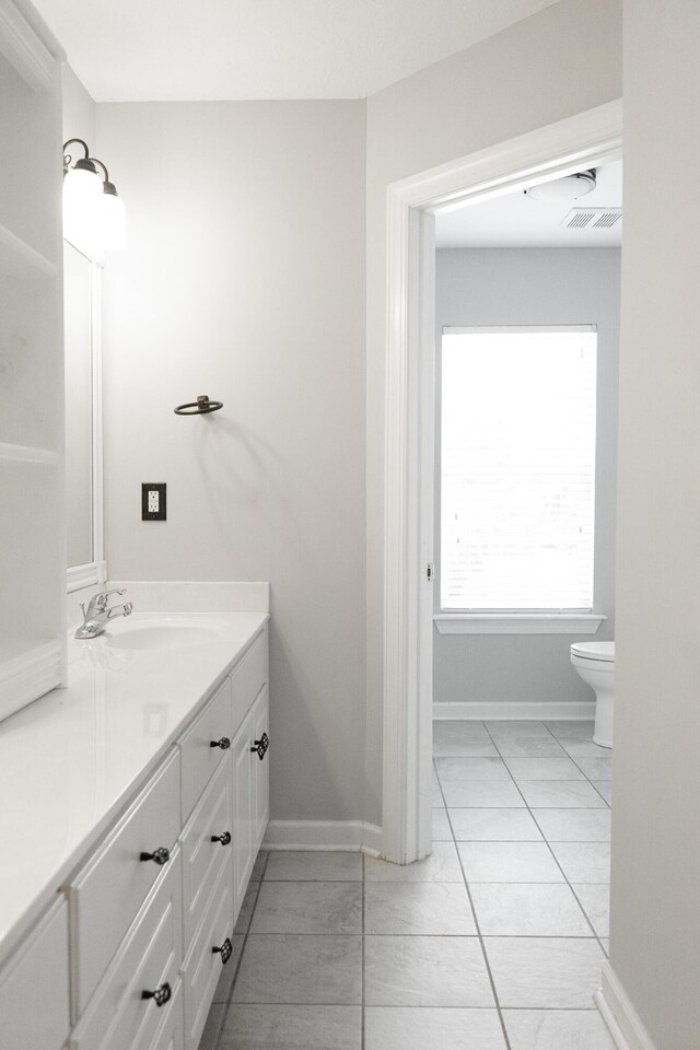 724 Avrett Cir, Evans, GA 30809 - bathroom featuring vanity, toilet, and baseboards