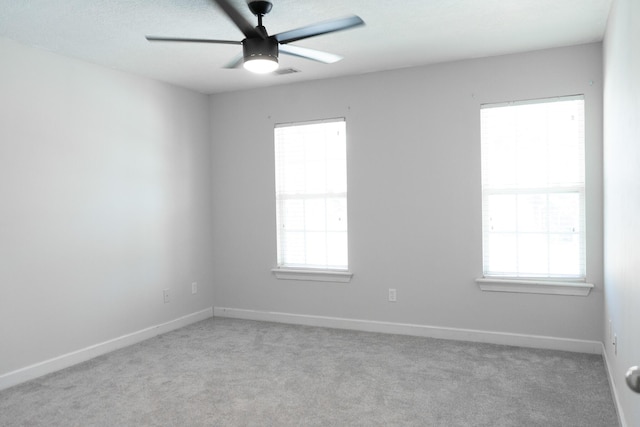 724 Avrett Cir, Evans, GA 30809 - spare room with a ceiling fan, light colored carpet, and baseboards
