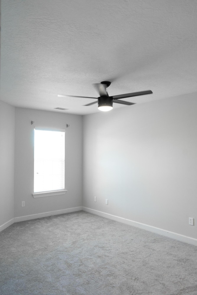 724 Avrett Cir, Evans, GA 30809 - carpeted spare room featuring ceiling fan, baseboards, and a textured ceiling