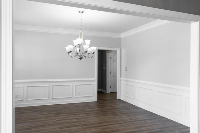 724 Avrett Cir, Evans, GA 30809 - unfurnished dining area with a chandelier, crown molding, wainscoting, and dark wood-type flooring