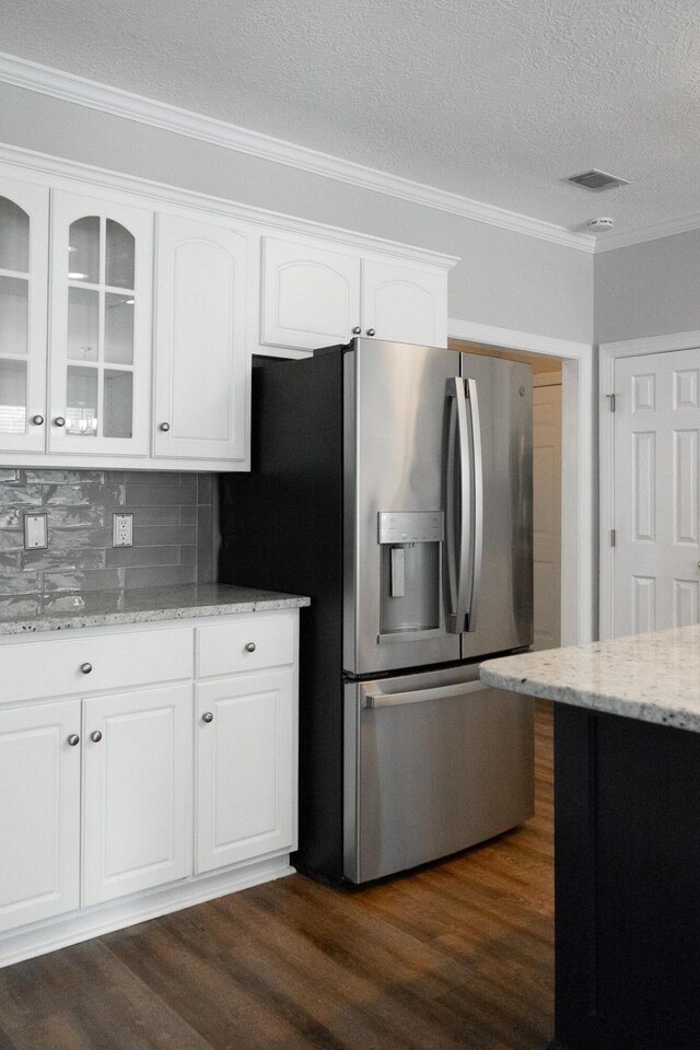724 Avrett Cir, Evans, GA 30809 - kitchen with stainless steel fridge with ice dispenser, crown molding, glass insert cabinets, white cabinets, and dark wood-type flooring