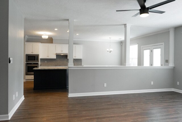 724 Avrett Cir, Evans, GA 30809 - kitchen with stainless steel appliances, dark wood finished floors, white cabinets, decorative backsplash, and crown molding
