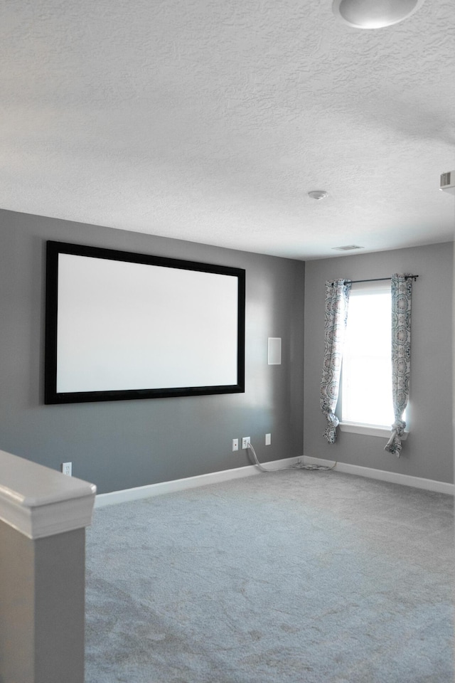 724 Avrett Cir, Evans, GA 30809 - home theater room with carpet floors, baseboards, and a textured ceiling